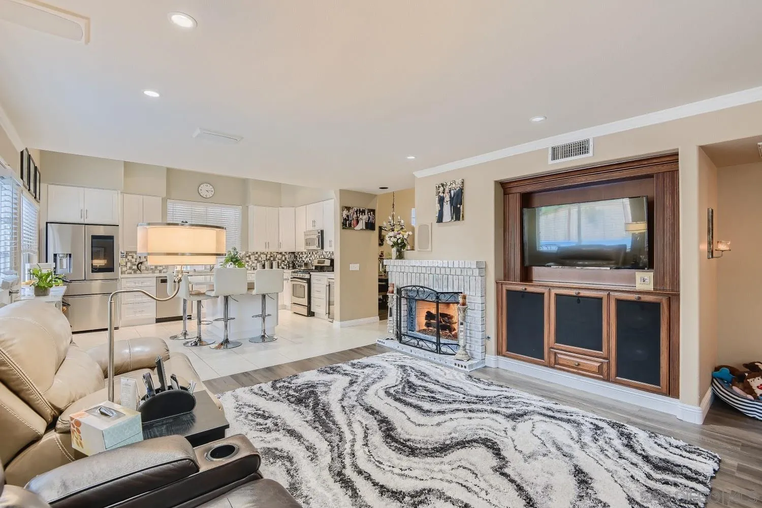 418 Helix Way Oceanside, CA 92057 - Photo 8 of 22 a bed room with furniture and a fireplace