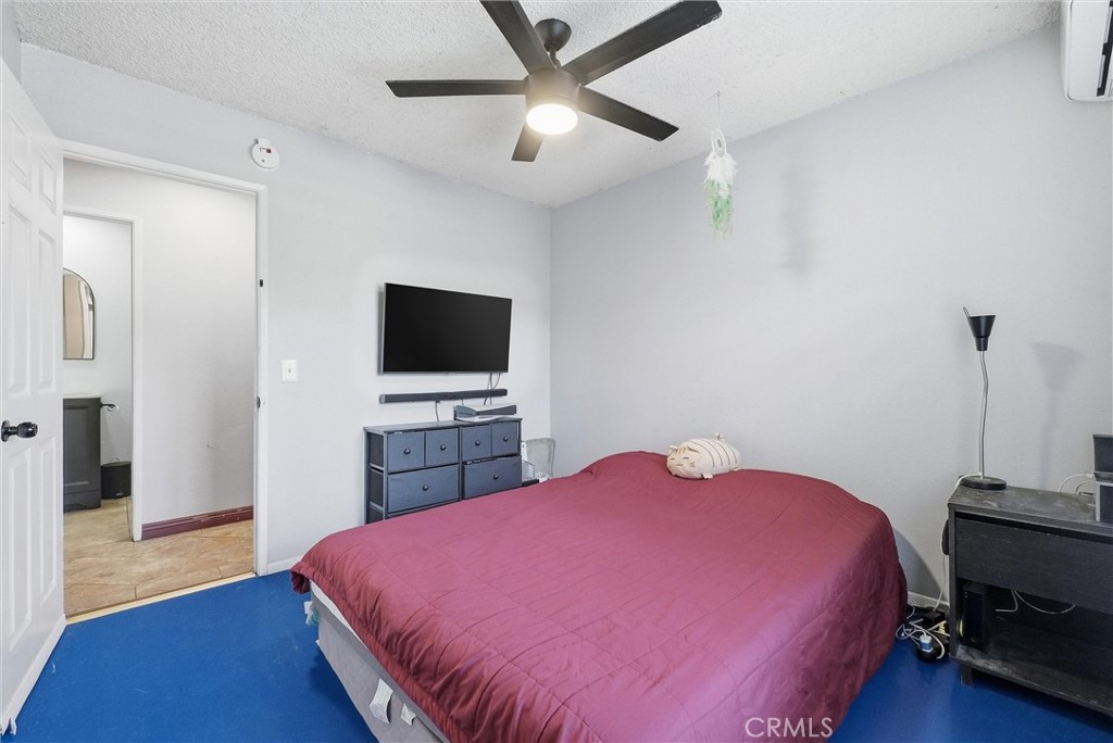 16716 East Renwick Road Azusa, CA 91702 - Photo 17 of 31 a bedroom with a bed and a flat screen tv