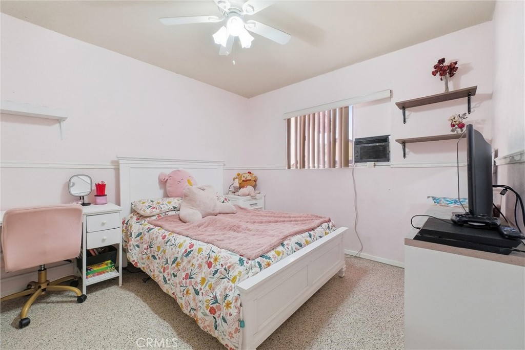 16716 East Renwick Road Azusa, CA 91702 - Photo 19 of 31 a bedroom with a bed and a chandelier