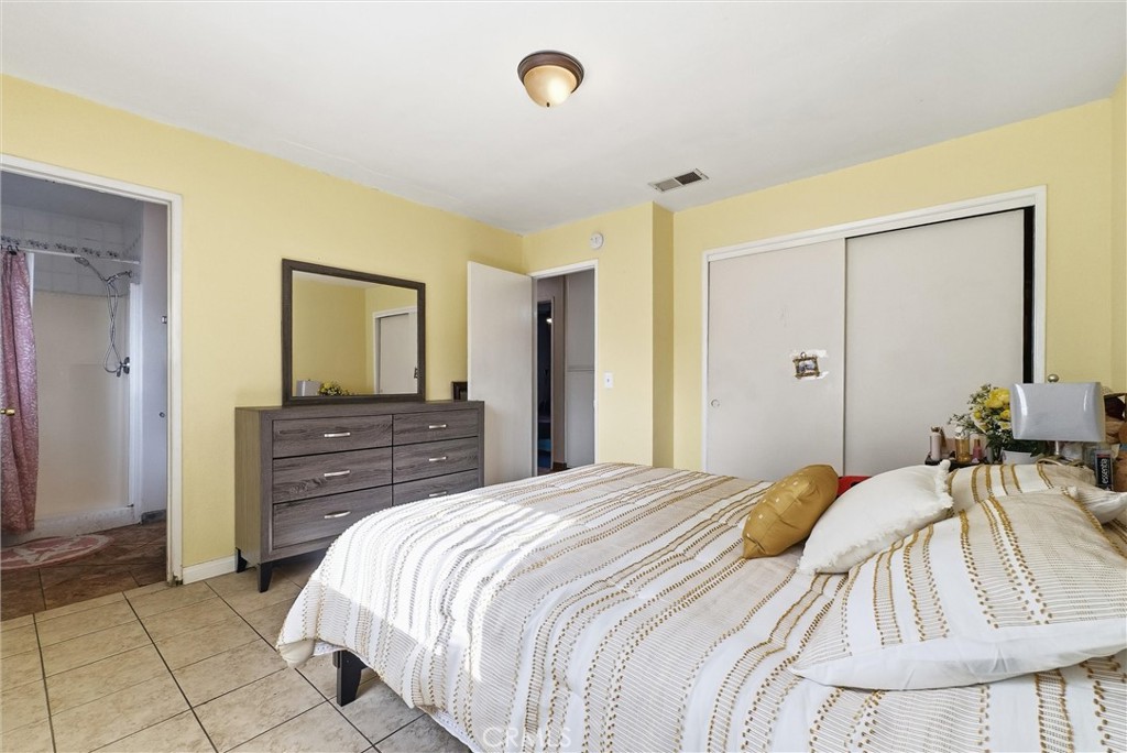 16716 East Renwick Road Azusa, CA 91702 - Photo 22 of 31 a bedroom with a bed and a mirror