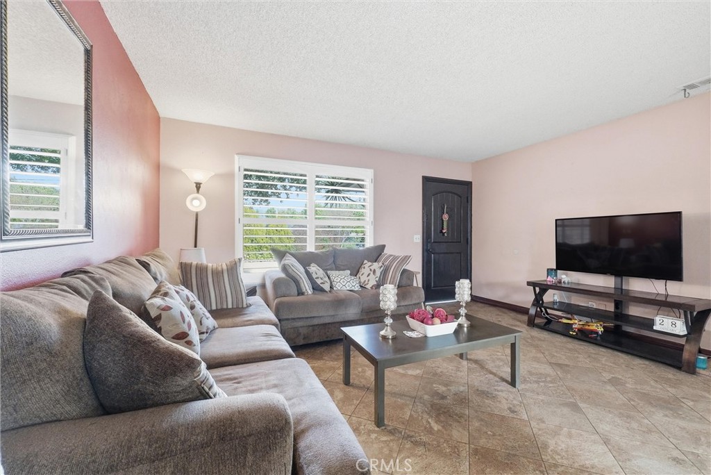 16716 East Renwick Road Azusa, CA 91702 - Photo 9 of 31 a living room with furniture and a flat screen tv