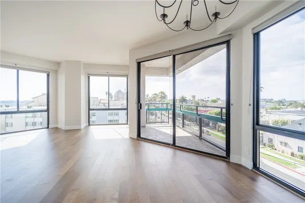a kitchen with stainless steel appliances granite countertop a refrigerator a sink and a stove