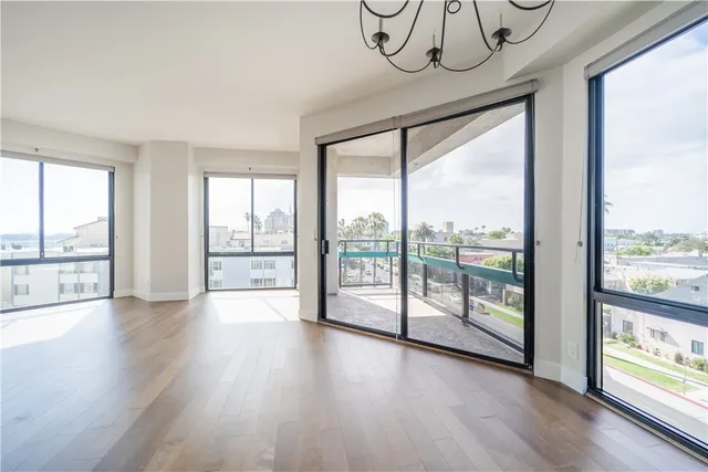 a kitchen with stainless steel appliances granite countertop a refrigerator a sink and a stove