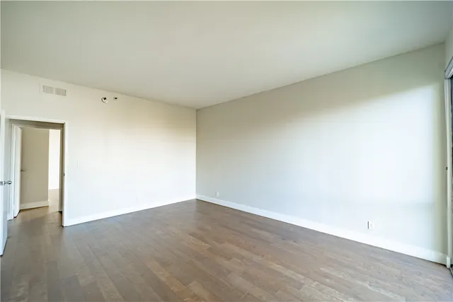 a bathroom with a sink double vanity granite tub shower and a mirror