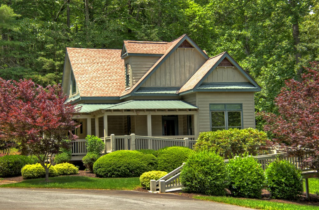 Lot 132 Fox Cove Road Blairsville, GA 30512 - Photo 13 of 35 a view of a white house with a small yard and plants