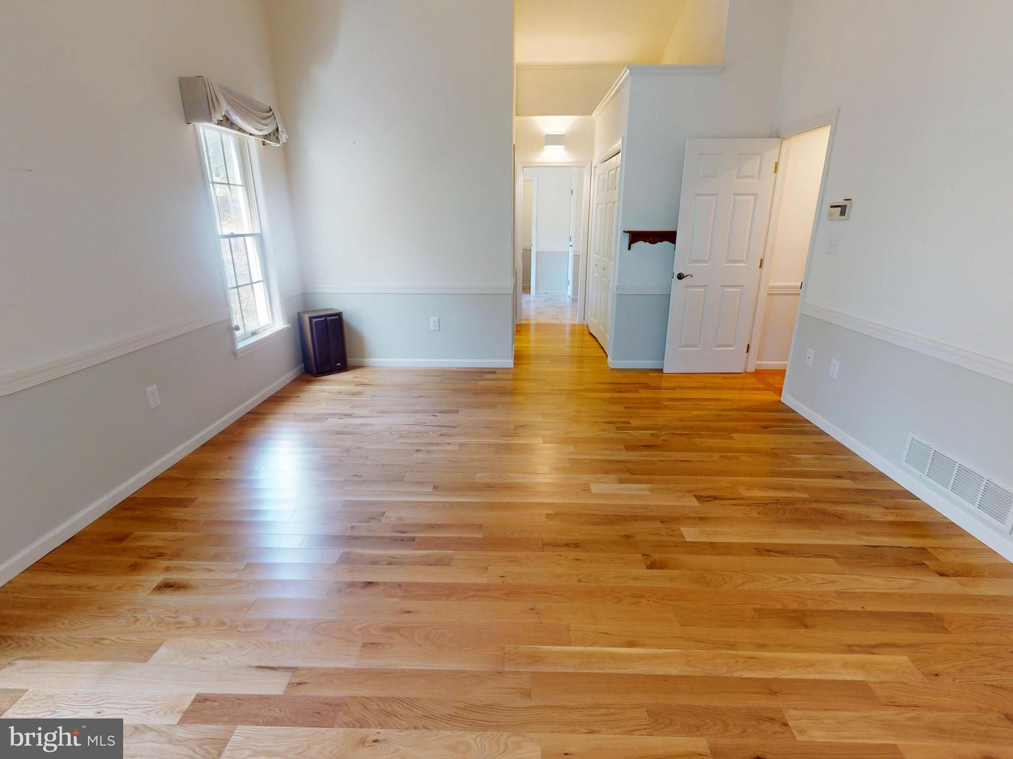 128 Colonial Court State College, PA 16801 - Photo 11 of 39 a view of empty room with wooden floor
