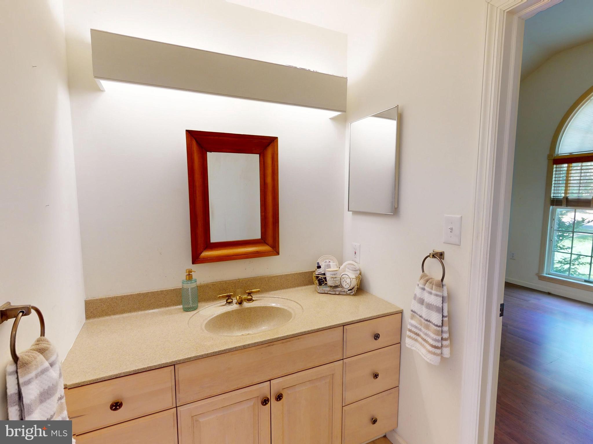 128 Colonial Court State College, PA 16801 - Photo 20 of 39 a bathroom with a sink and a mirror