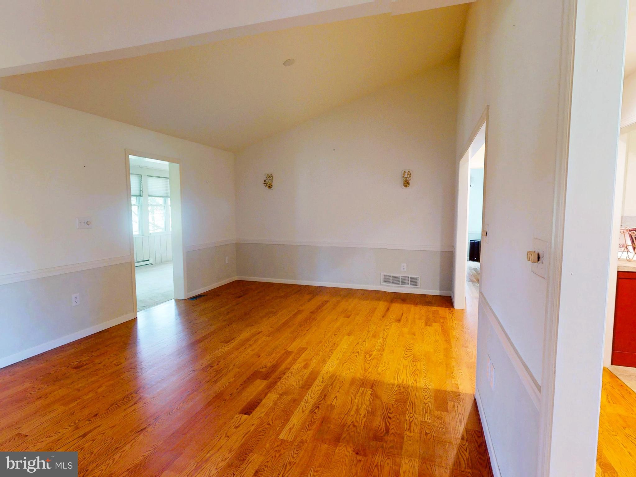 128 Colonial Court State College, PA 16801 - Photo 5 of 39 an empty room with wooden floor and windows