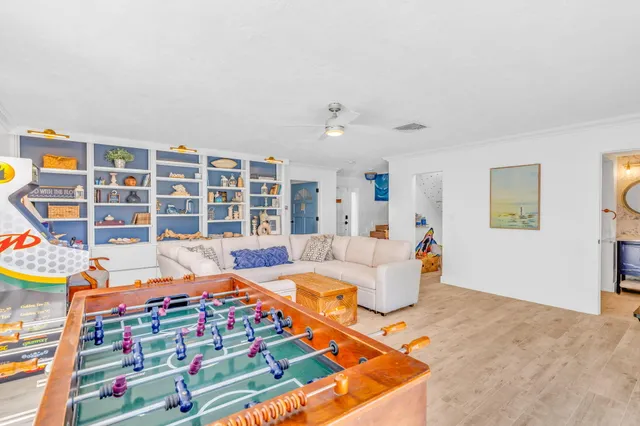 a bedroom with furniture and a book shelf