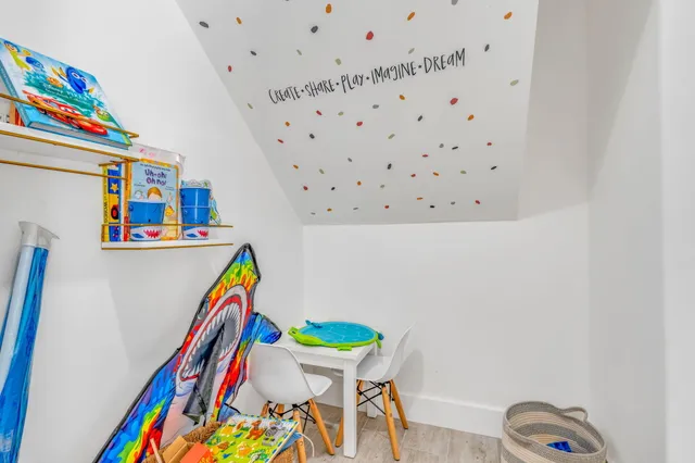 a room with furniture and a wooden floor