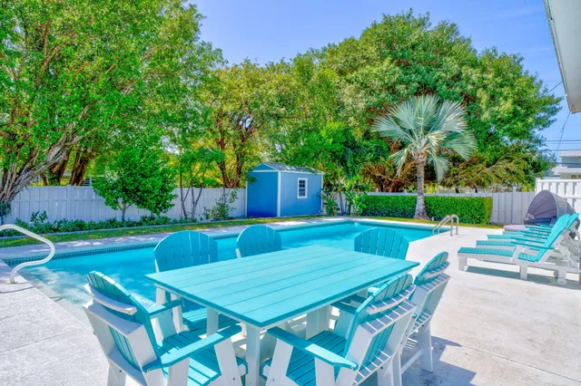 a view of backyard with seating and green space