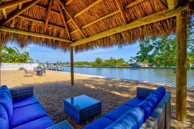 a view of a backyard with sitting area
