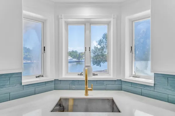 a kitchen with a sink and a window