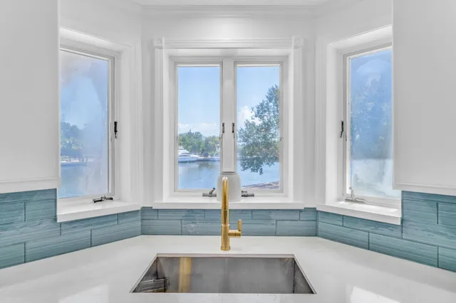 a kitchen with a sink and a window
