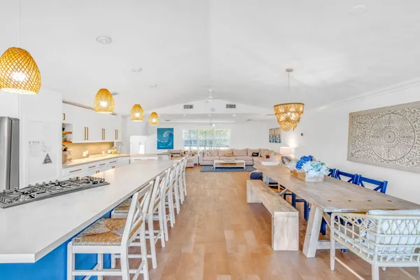 a kitchen with stainless steel appliances granite countertop a sink and a stove