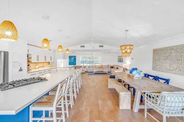 a kitchen with stainless steel appliances granite countertop a sink and a stove