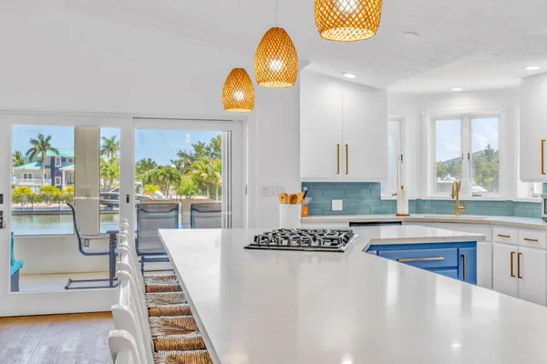 a kitchen with counter top space cabinets and window
