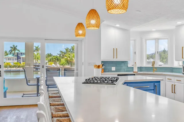 a kitchen with counter top space cabinets and window
