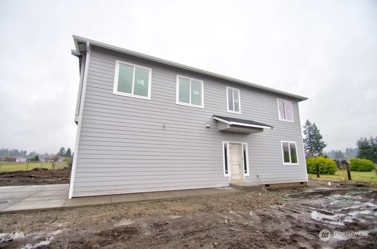 17942 Jordan Street Southwest Rochester, WA 98579 - Photo 10 of 13 a front view of a house with garage