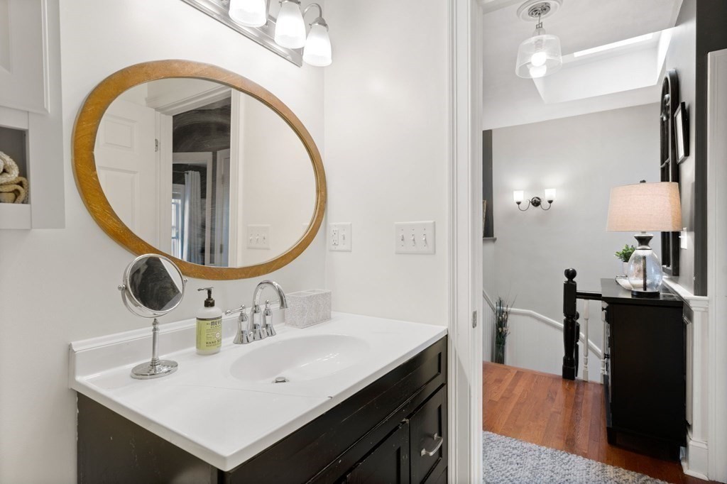 293 West 2nd Street, Unit 3 Boston, MA 02127 - Photo 14 of 25 a bathroom with a sink and a mirror