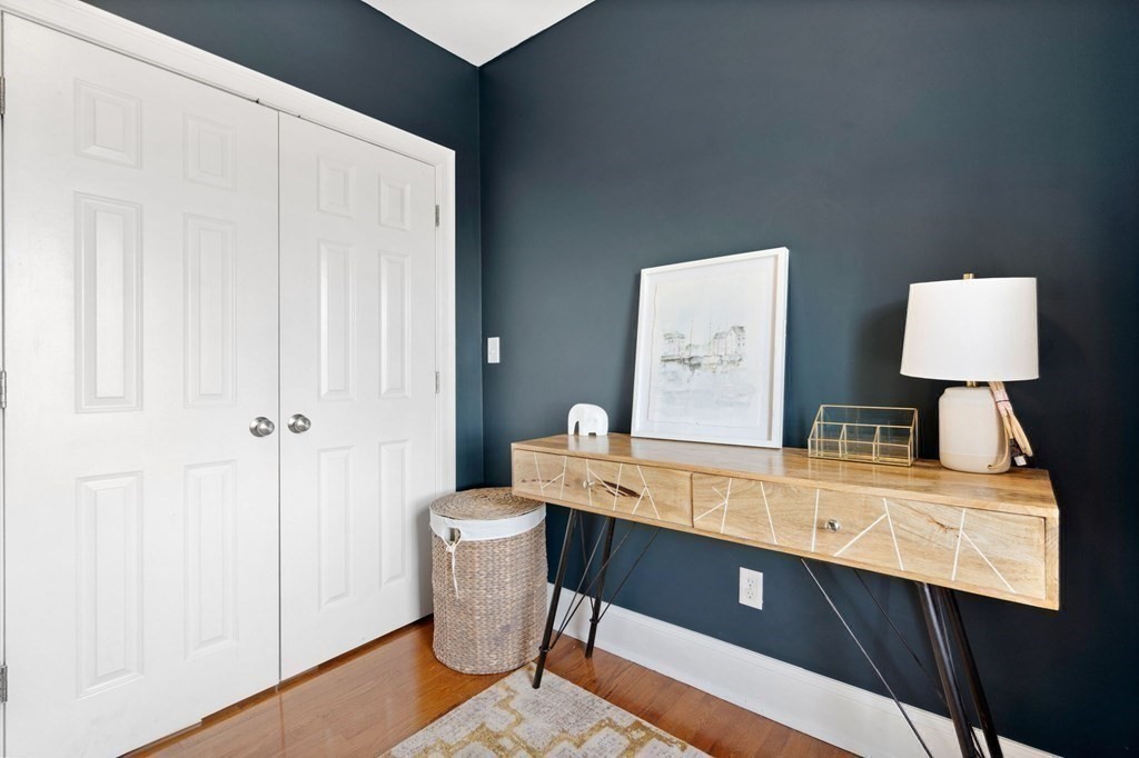 293 West 2nd Street, Unit 3 Boston, MA 02127 - Photo 19 of 25 a room with a table chairs and a lamp