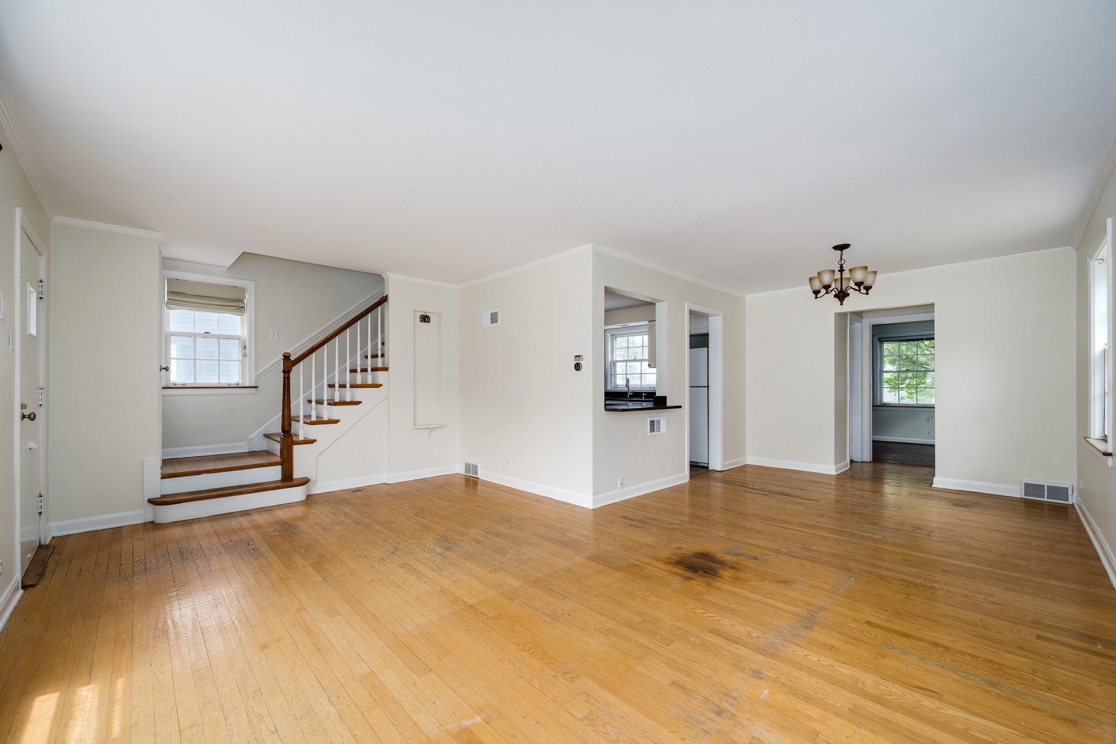 2104 Linneman Street Glenview, IL 60025 - Photo 2 of 19 a view of empty room with kitchen and window