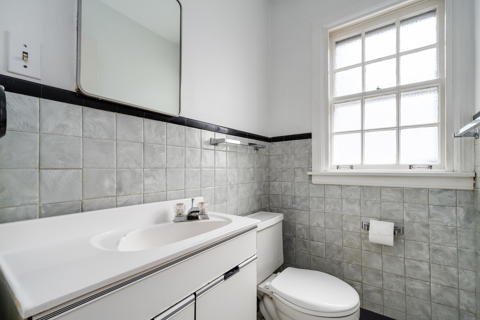 2104 Linneman Street Glenview, IL 60025 - Photo 8 of 19 a bathroom with a sink a toilet and window