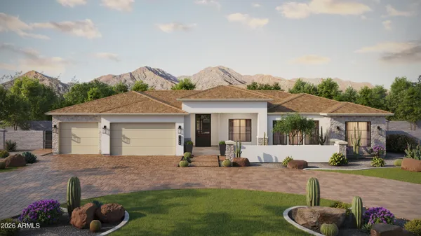 a front view of a house with a garden and patio