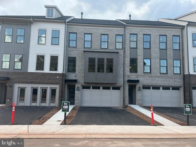 23693 Hardesty Terrace Ashburn, VA 20148 - Photo 1 of 12 a front view of a building with windows