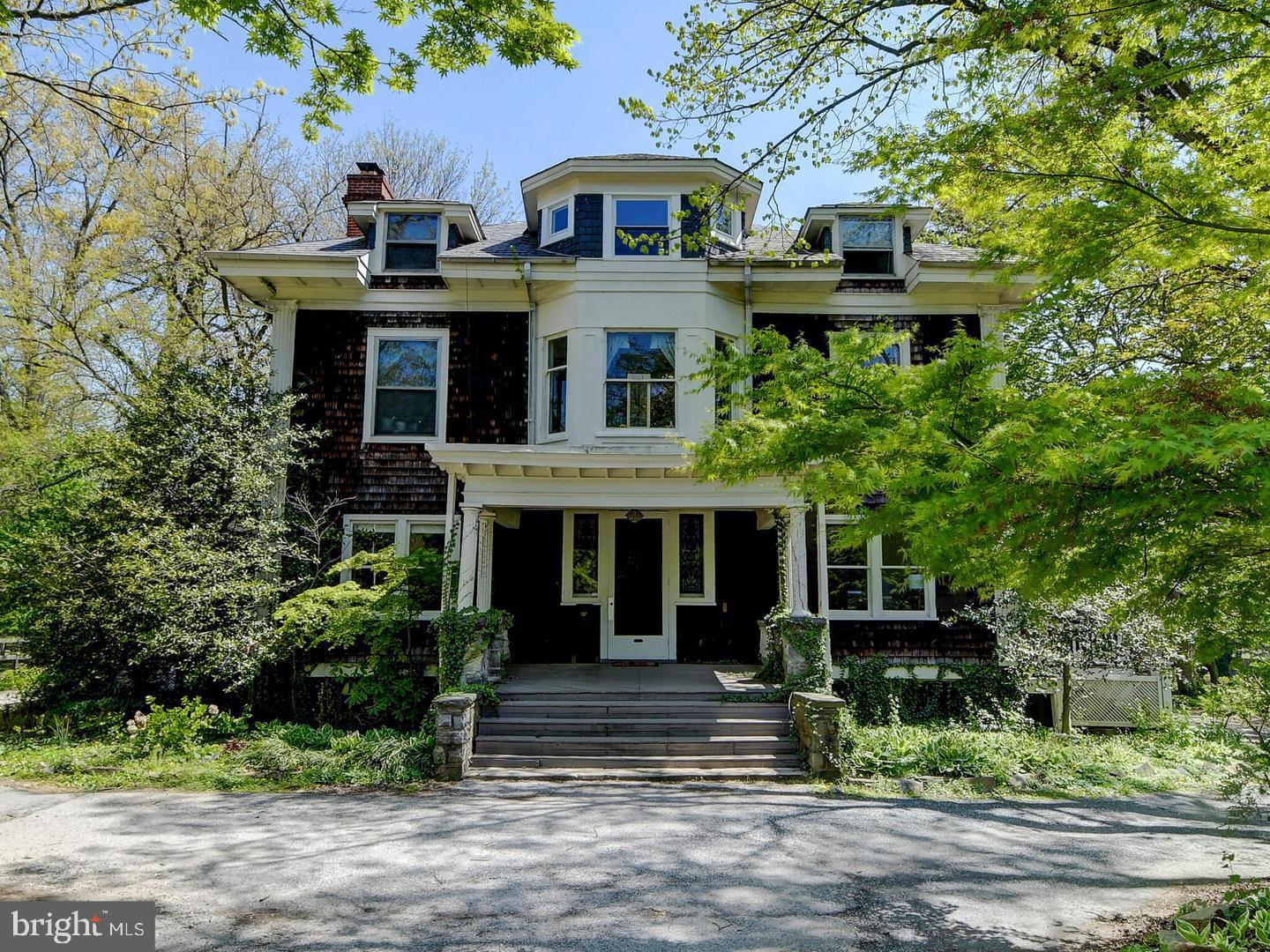 5713 Roland Avenue Baltimore, MD 21210 - Photo 1 of 29 a front view of a house with a yard