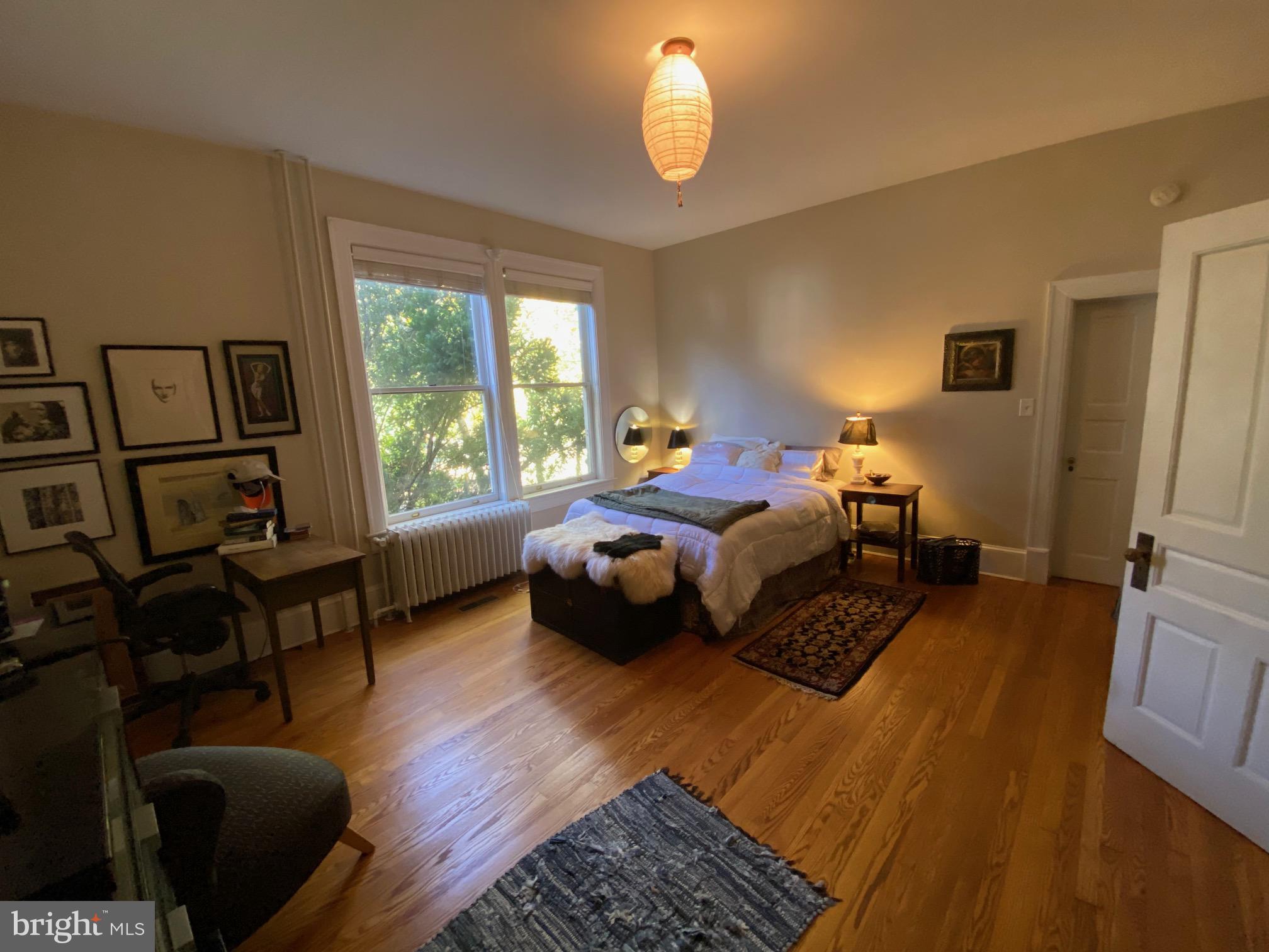 5713 Roland Avenue Baltimore, MD 21210 - Photo 11 of 29 a bedroom with furniture and a large window