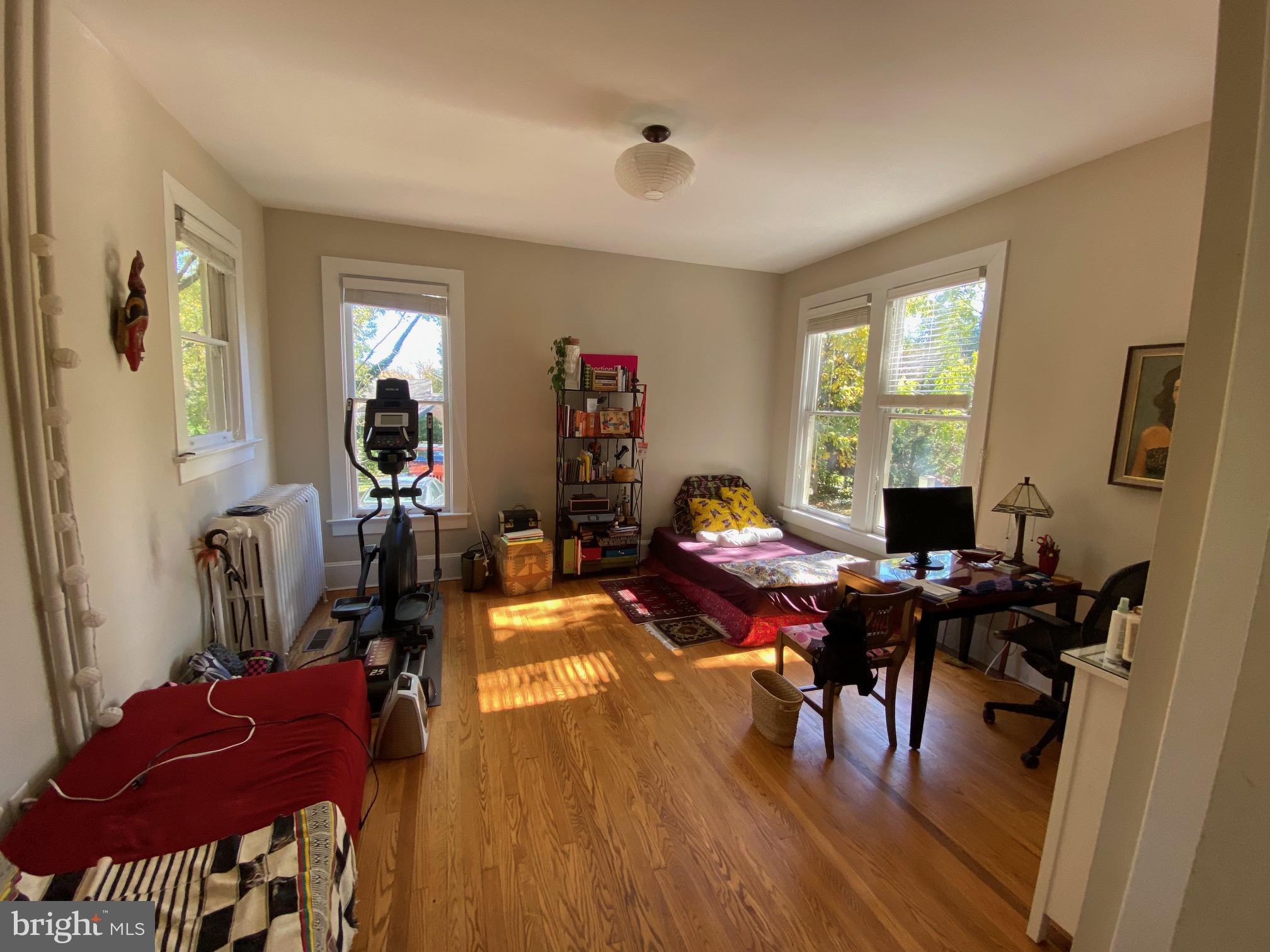 5713 Roland Avenue Baltimore, MD 21210 - Photo 12 of 29 a living room with furniture and wooden floor