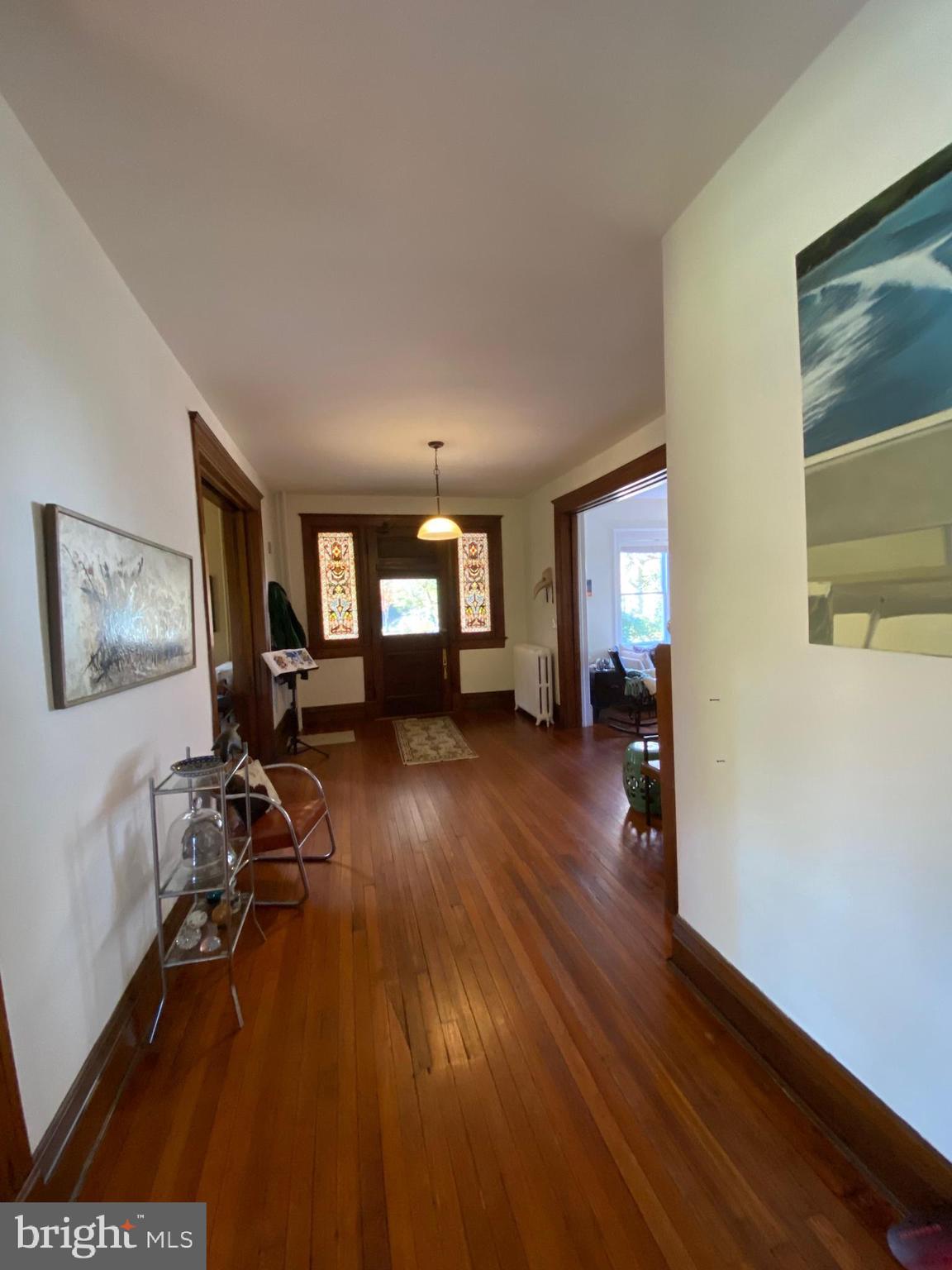 5713 Roland Avenue Baltimore, MD 21210 - Photo 13 of 29 a living room with furniture and a wooden floor