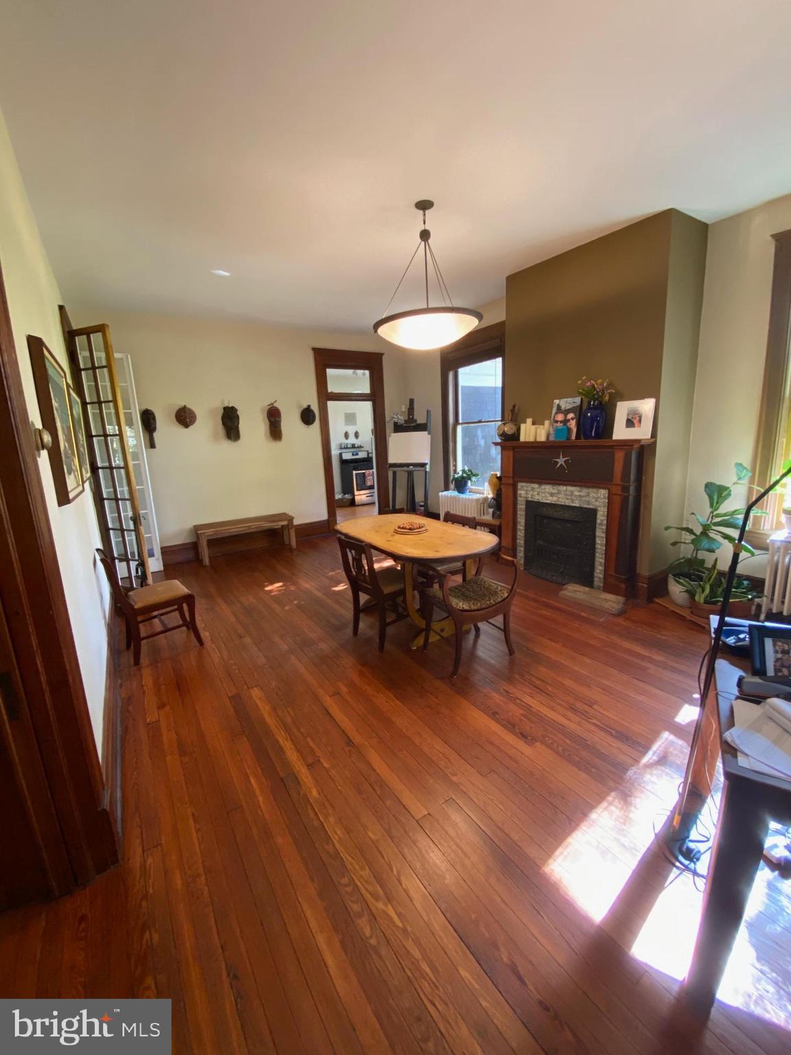 5713 Roland Avenue Baltimore, MD 21210 - Photo 4 of 29 a living room with furniture and a wooden floor