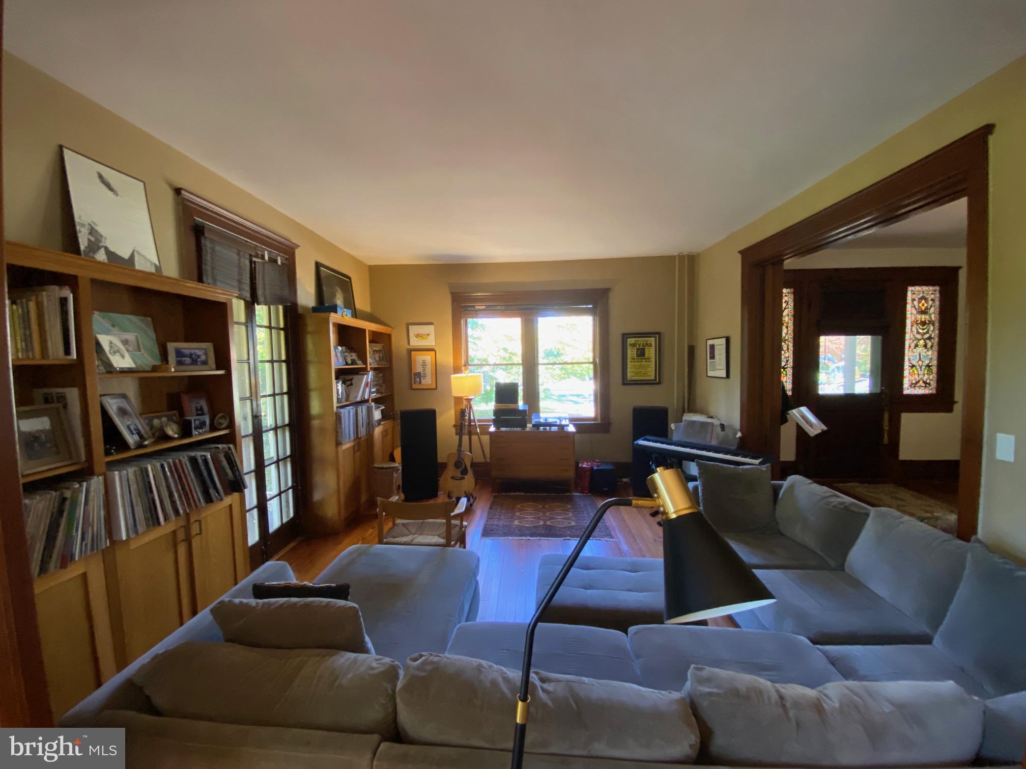 5713 Roland Avenue Baltimore, MD 21210 - Photo 9 of 29 a living room with furniture and a book shelf