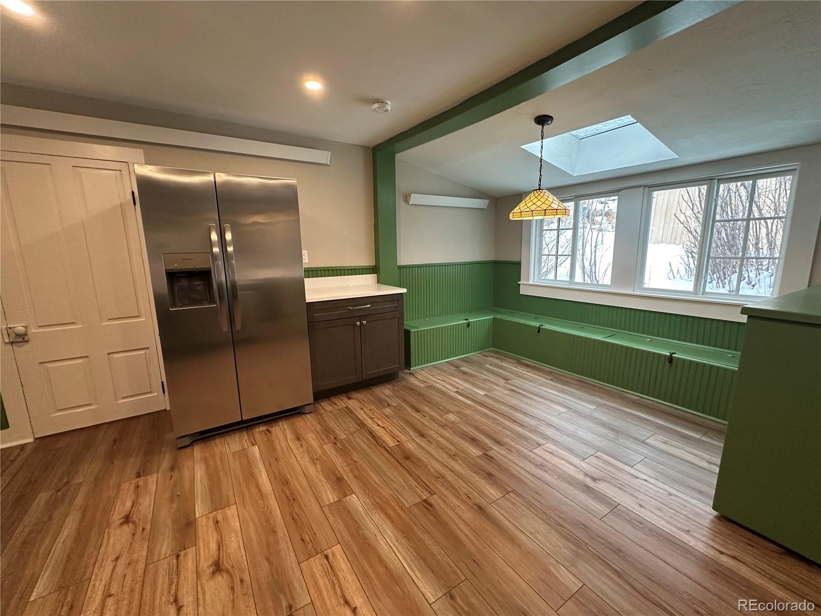 906 Main Street Georgetown, CO 80444 - Photo 13 of 28 a room with window and wooden floor