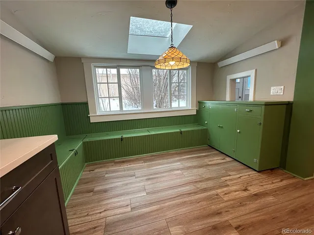 a room with green walls and a window