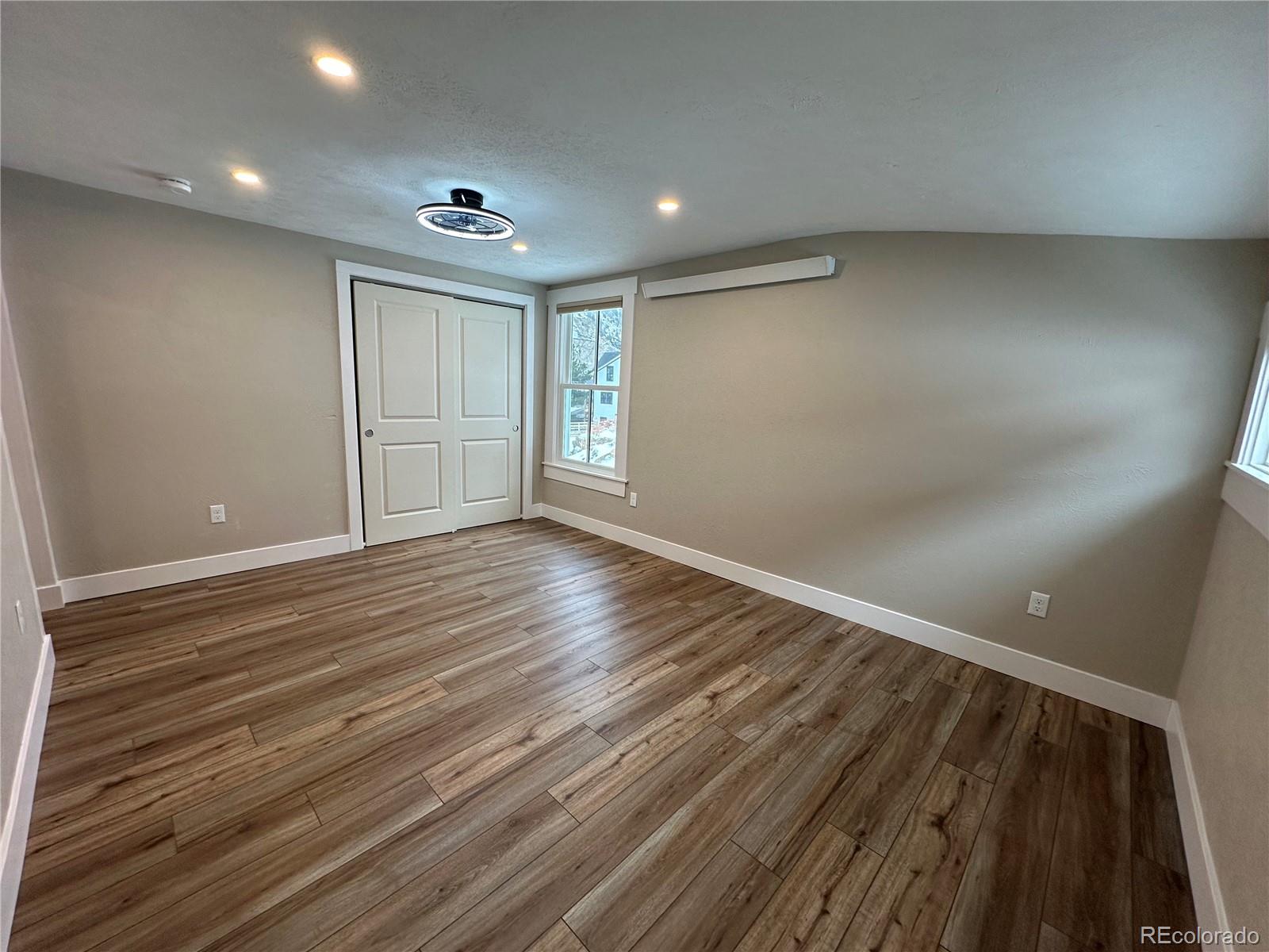 906 Main Street Georgetown, CO 80444 - Photo 9 of 28 a view of an empty room with wooden floor