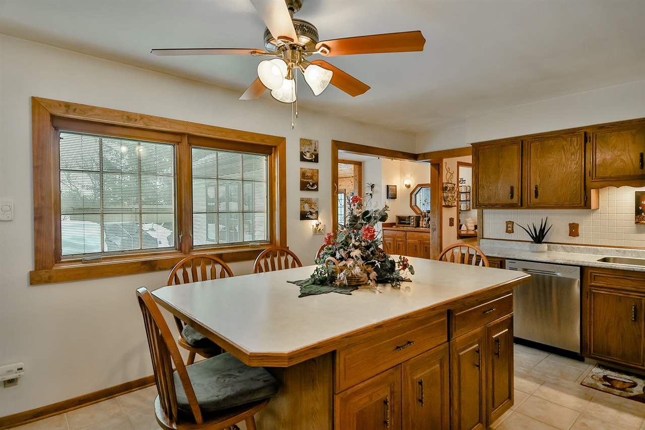 12944 Huntsboro Lane Roscoe, IL 61073 - Photo 12 of 40 a view of a dining room with furniture window and wooden floor
