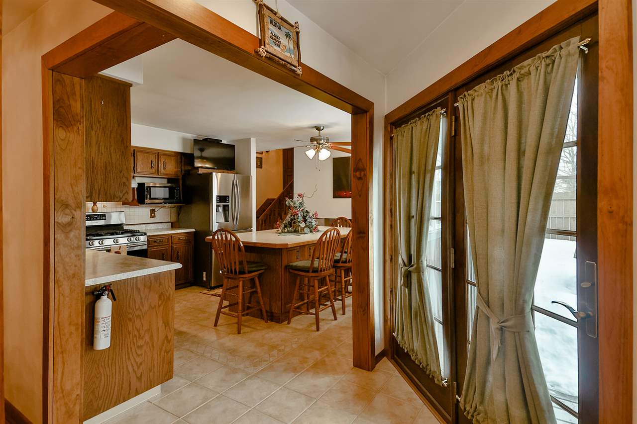 12944 Huntsboro Lane Roscoe, IL 61073 - Photo 13 of 40 a view of a dining room with furniture window and outside view