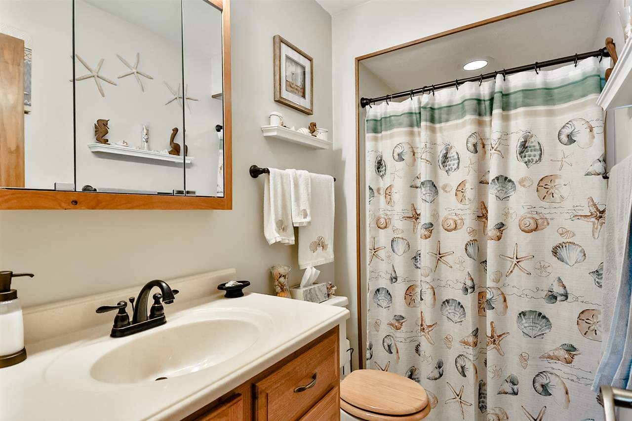 12944 Huntsboro Lane Roscoe, IL 61073 - Photo 22 of 40 a bathroom with a sink and a mirror