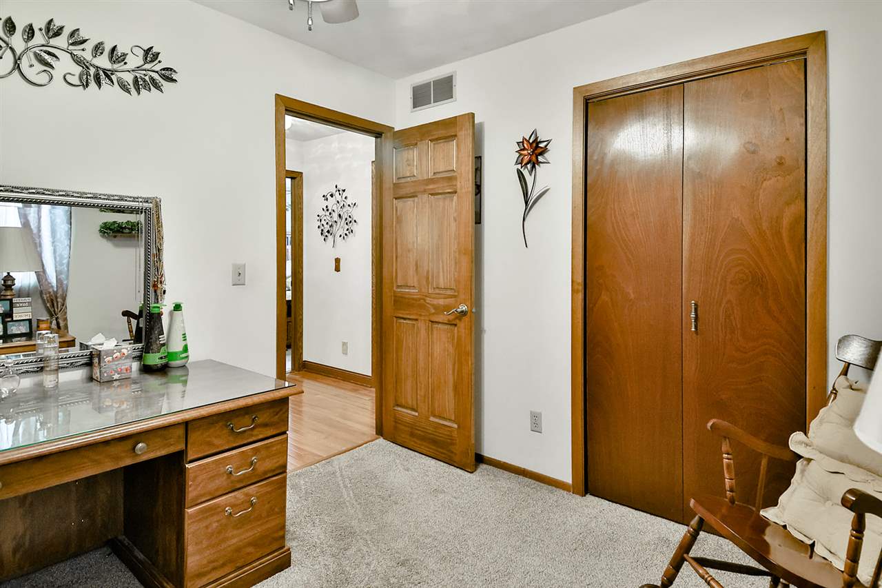 12944 Huntsboro Lane Roscoe, IL 61073 - Photo 24 of 40 a spacious bathroom with a granite countertop sink and a mirror
