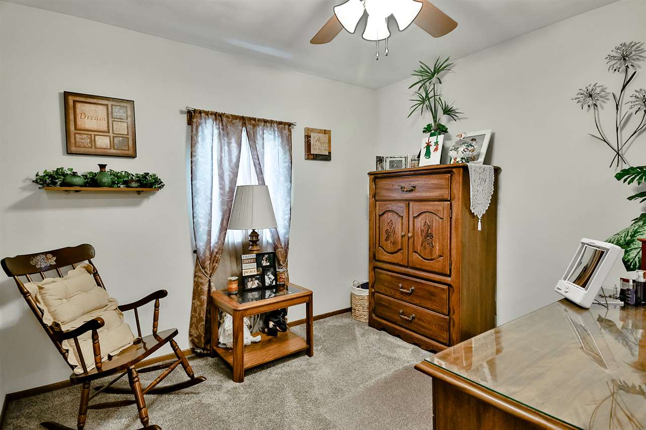 12944 Huntsboro Lane Roscoe, IL 61073 - Photo 25 of 40 a living room with furniture and a window