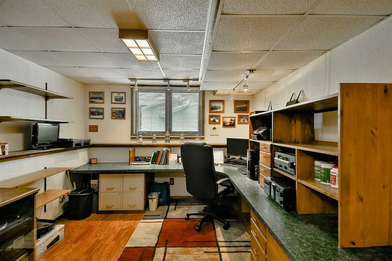 12944 Huntsboro Lane Roscoe, IL 61073 - Photo 32 of 40 a kitchen with a sink a counter and appliances