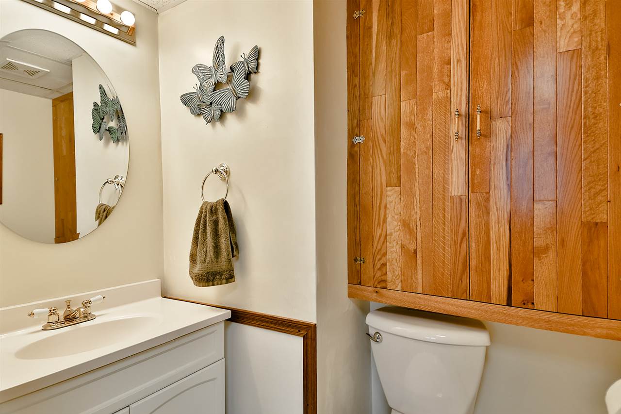 12944 Huntsboro Lane Roscoe, IL 61073 - Photo 33 of 40 a bathroom with a sink a mirror and a vanity