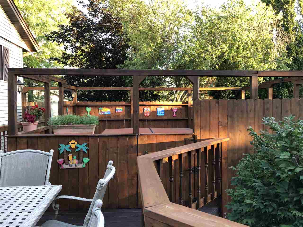 12944 Huntsboro Lane Roscoe, IL 61073 - Photo 35 of 40 a view of balcony with wooden floor and outdoor seating