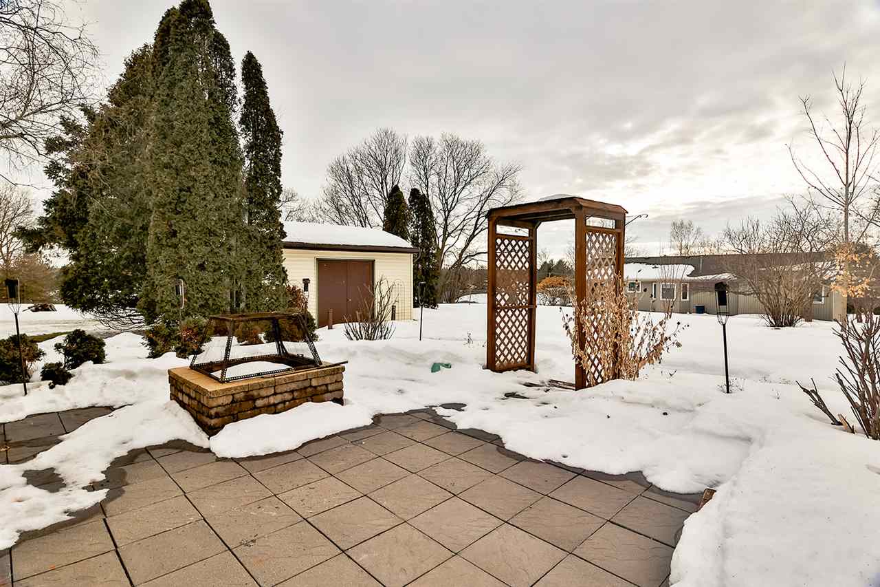 12944 Huntsboro Lane Roscoe, IL 61073 - Photo 6 of 40 a view of a white house in the snow yard