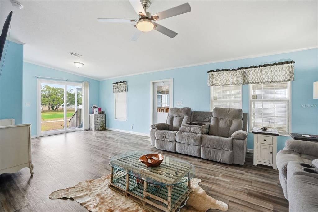 9100 Highpoint Boulevard Brooksville, FL 34613 - Photo 16 of 42 a living room with furniture and a window