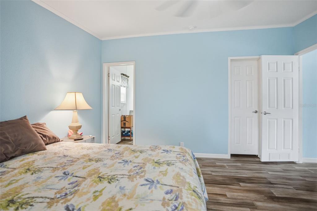 9100 Highpoint Boulevard Brooksville, FL 34613 - Photo 17 of 42 a bedroom with a bed and a lamp