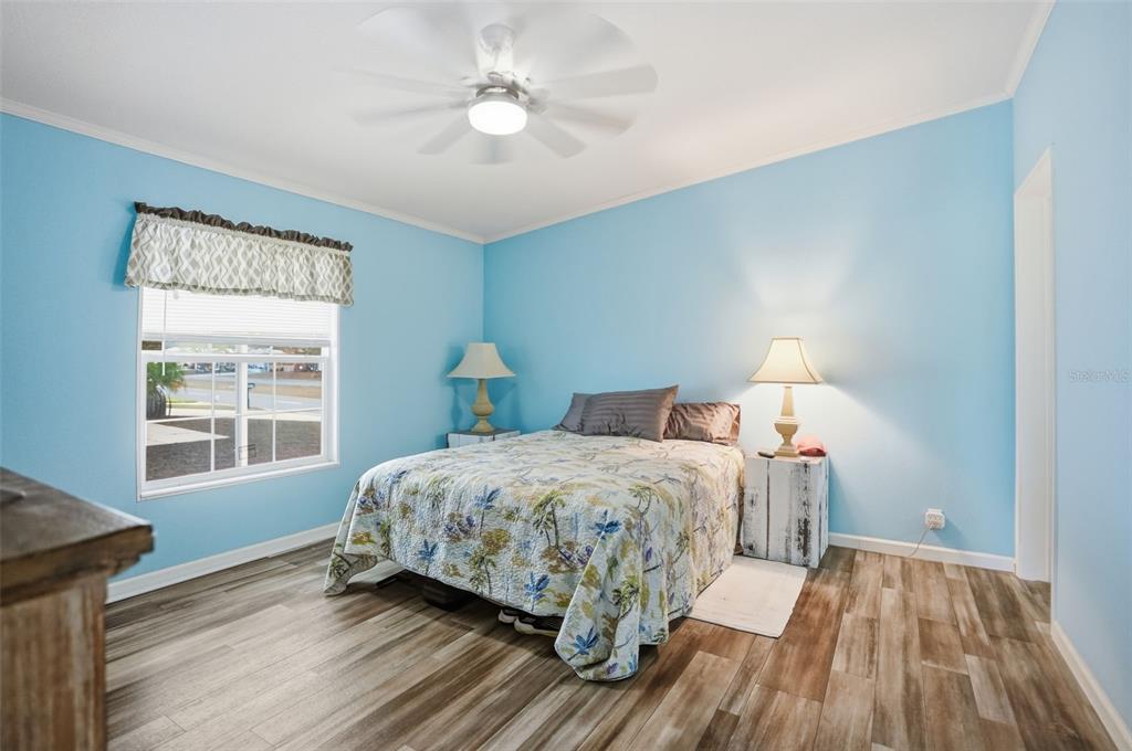 9100 Highpoint Boulevard Brooksville, FL 34613 - Photo 18 of 42 a bedroom with a bed and a window